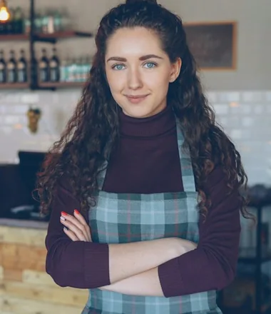 Owner of Morning Shift Coffee behind her counter